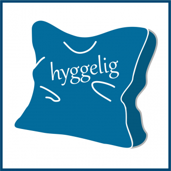 Pictograph cushion with text "hyggelig"